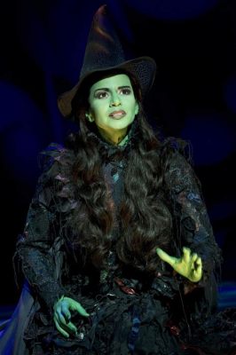 in the musical wicked what elphaba nyt How does Elphaba's character in Wicked reflect the broader themes of ambition and isolation in society?